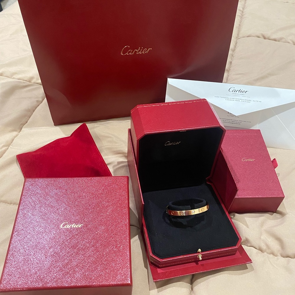 Cartier love cuff bracelet in yellow gold with one diamond